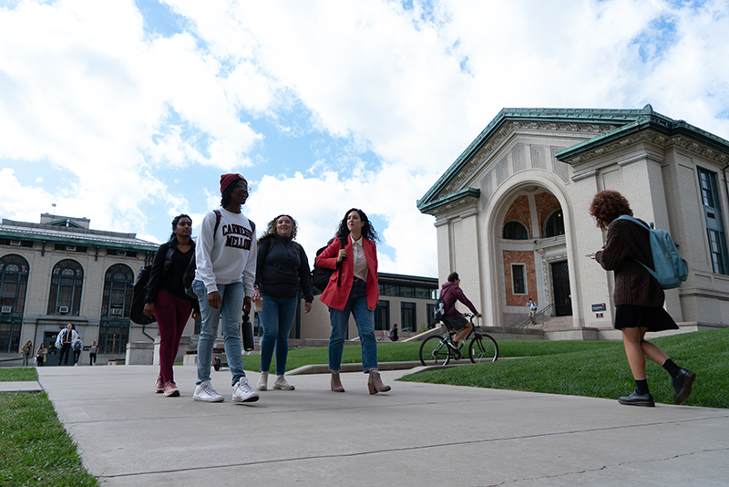 People walking across campus