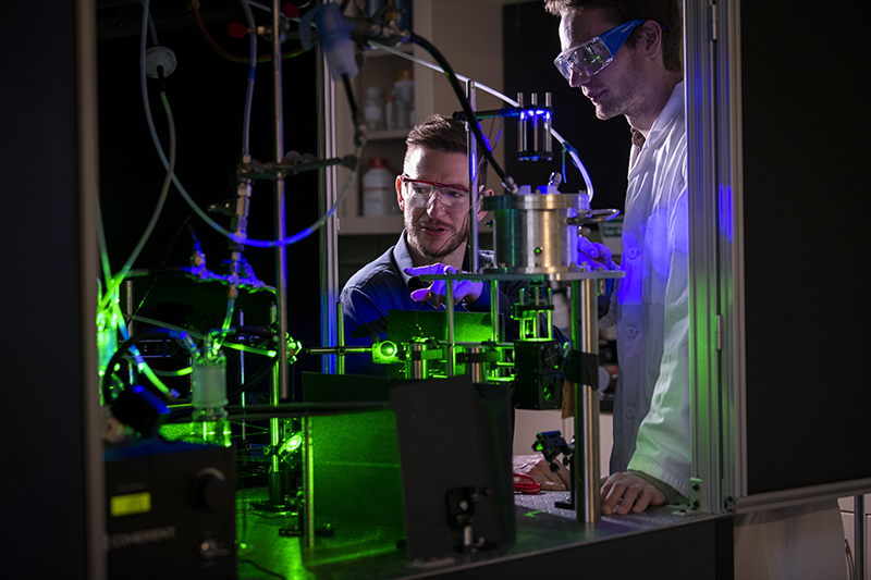 Ryan Sullivan and a graduate student in the lab