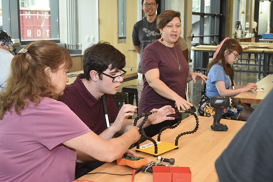 Students working on a hands-on project in Tech Spark