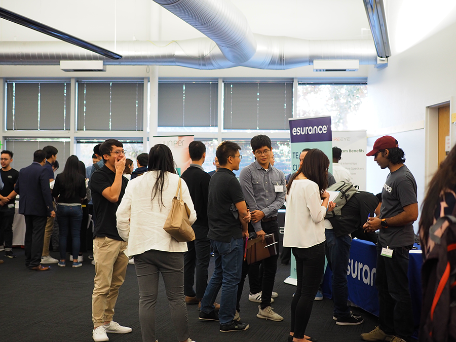 View of the room from the 2019 event, showing various booths