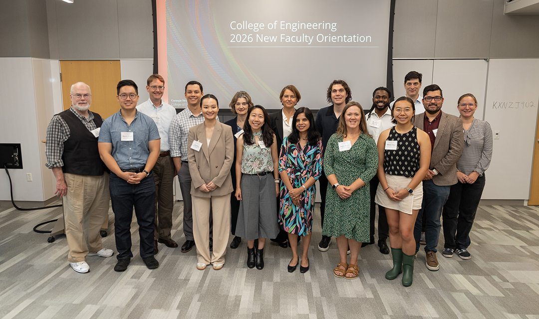 2026 new faculty cohort poses for group photo during orientation event