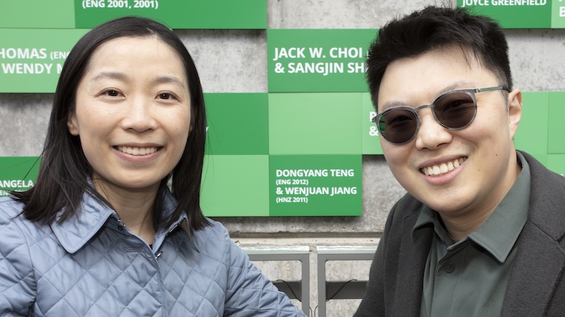 A woman and man wearing sunglasses in front of FOEB
