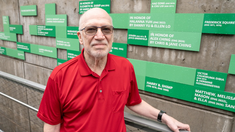 A man in a red shirt in front of the FOEB