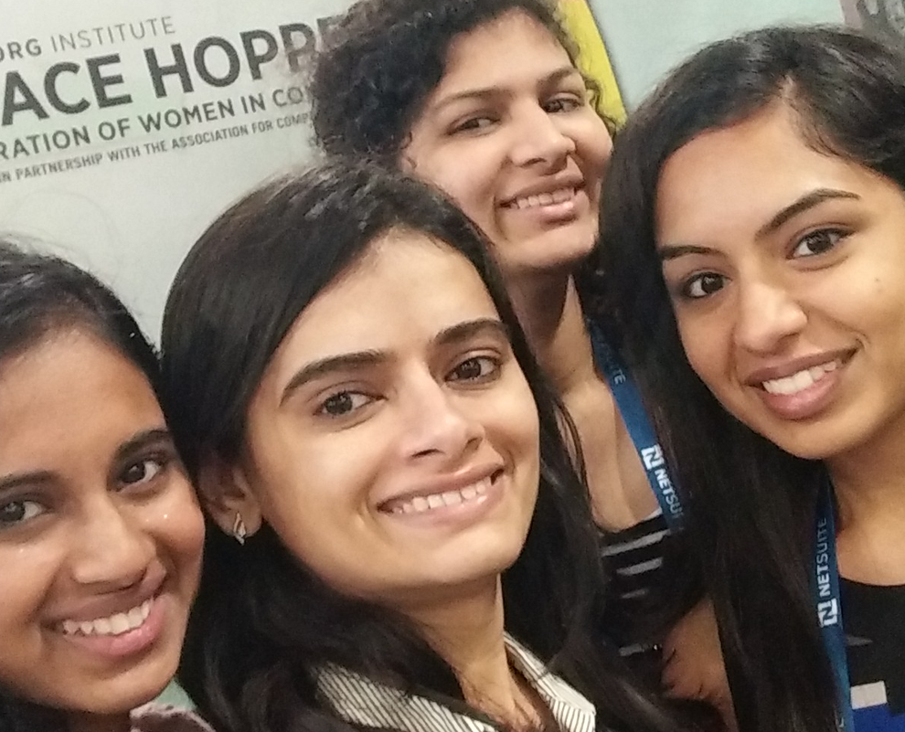 Four INI students at the Grace Hopper Celebration of Women in Computing