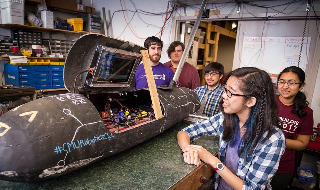 RoboBuggy team stands next to CMU's first autonomous buggy