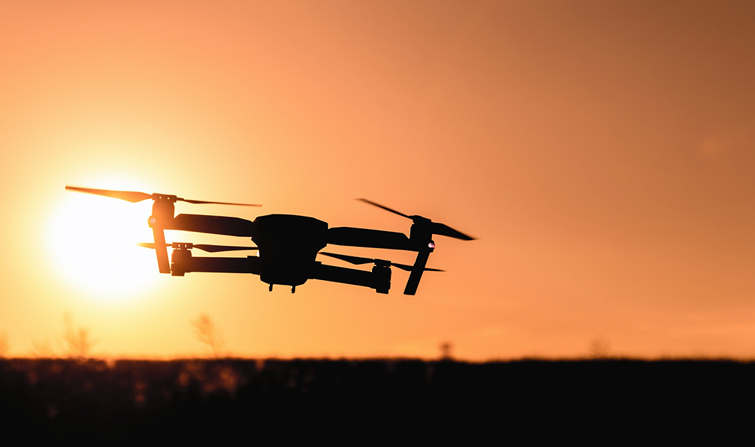 Drone in sky during sunset