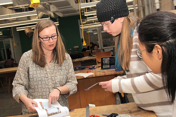 Rebecca Taylor interacting with students in a lab