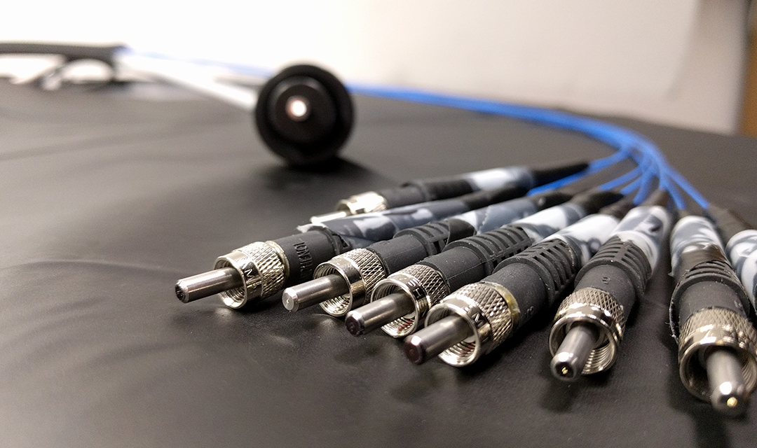 Small optical fibers connected to a larger one