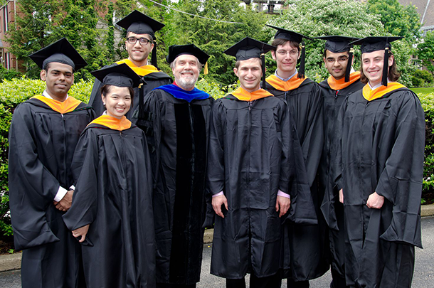 Landis with students at graduation