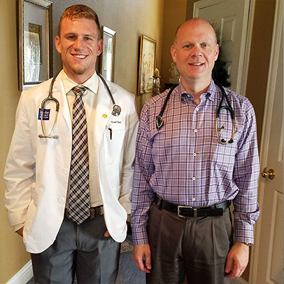 2 men, both with stethoscopes