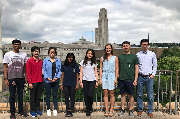 Group of people standing in front of Cathedral of Learning