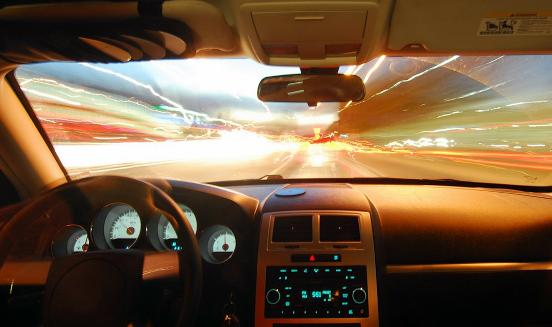 Image of car dashboard with electricity field on the horizon
