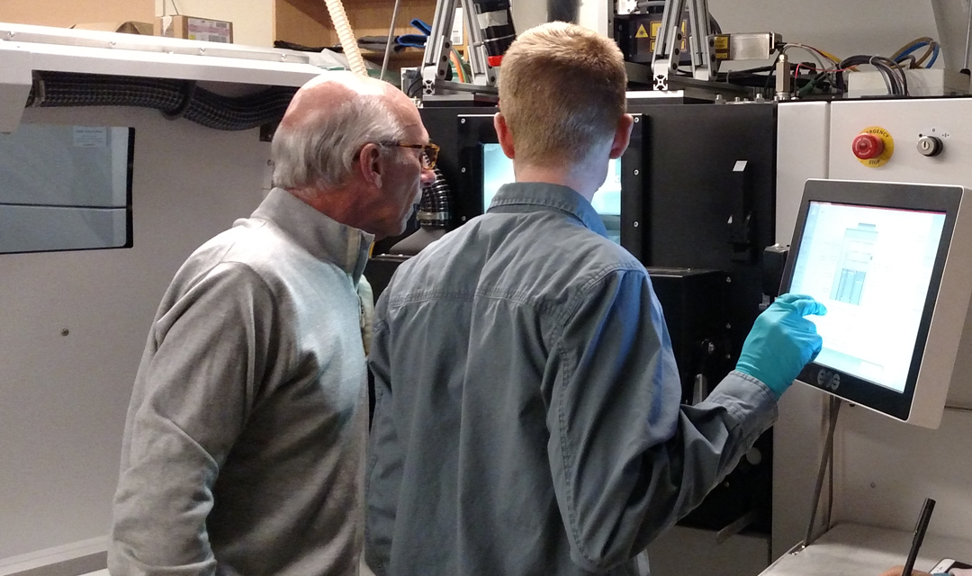 David Coulter with a student in an advanced manufacturing lab.