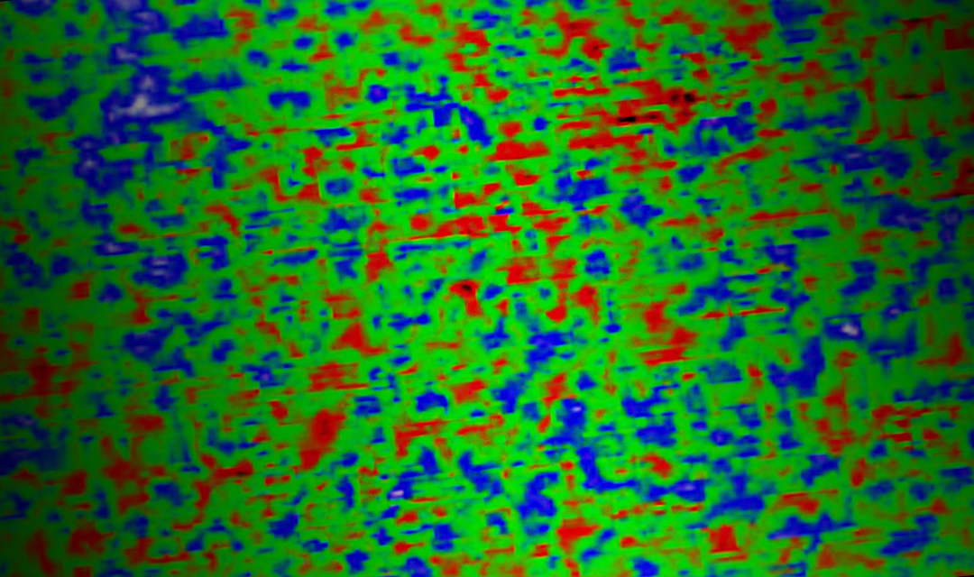 Ceramic material (an abstract photo with a green background and red and blue splotches)