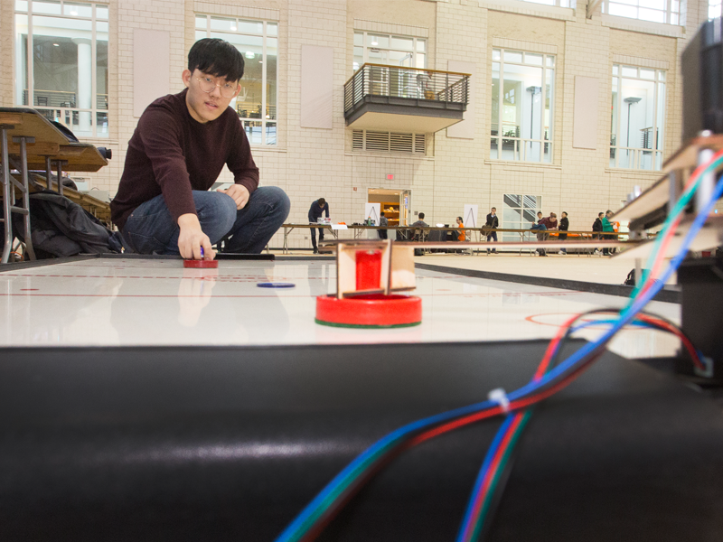 ECE sophomores Hojun Byun, Junwon Chang, Alvin Shek, Venkata Vivek Thallam, and Yang Yue created an arm attachment for an air hockey table.