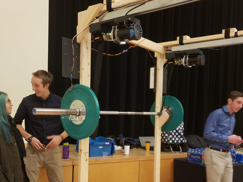 MechE students and weightlifting enthusiasts Vida Ekhlas, Andrew Harter, Reed Farber, Wade Lacey, Shani Rosenthal created a machine that can spot a lifter in the gym.