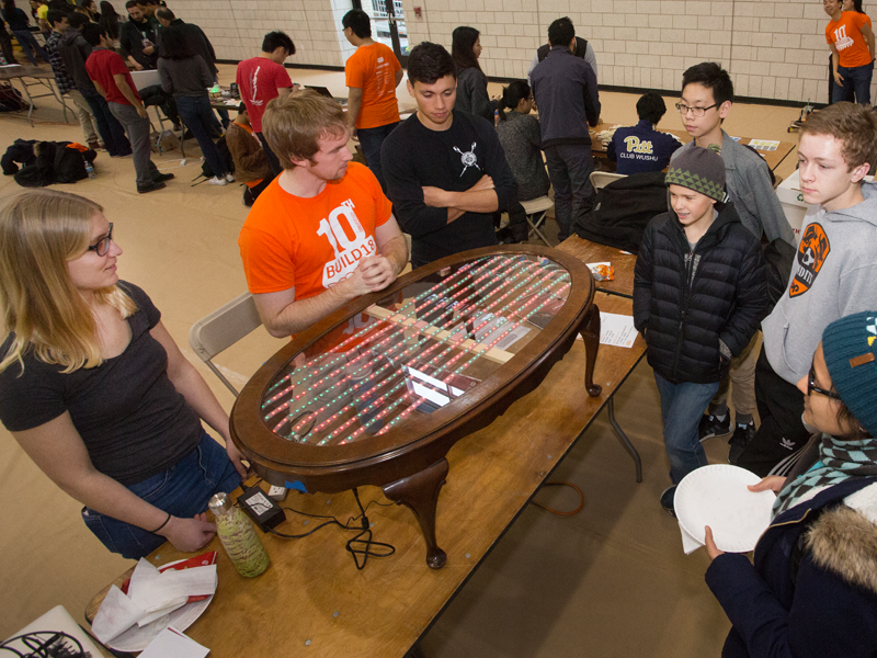 MechE and Computer Science juniors Nikolai Flowers, Justine Olshan, Vinay Mitta refurbished and old table into an aesthetic new piece of furniture that could even play simple games like Pong.