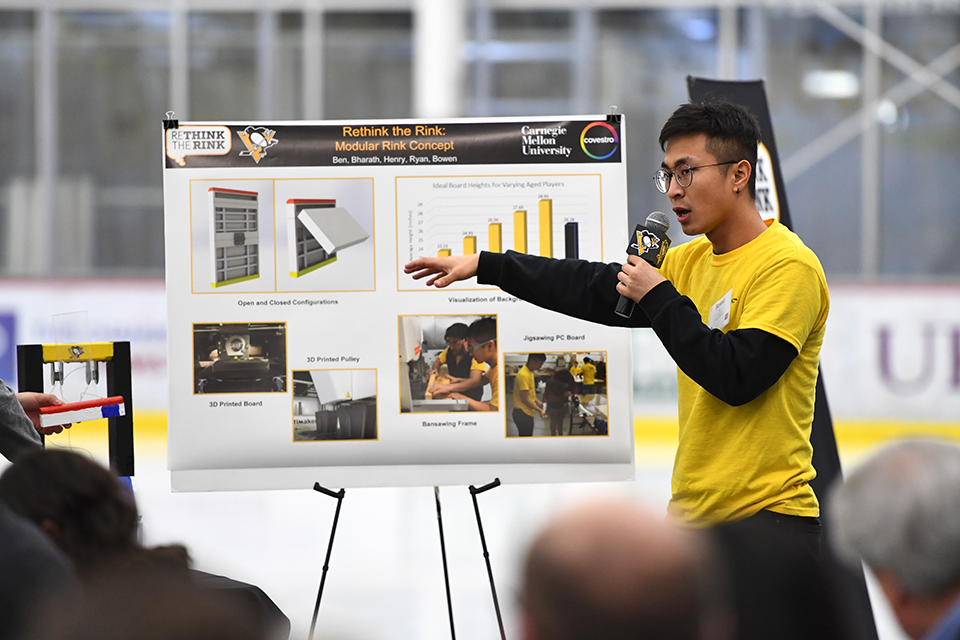 Student presenting a poster