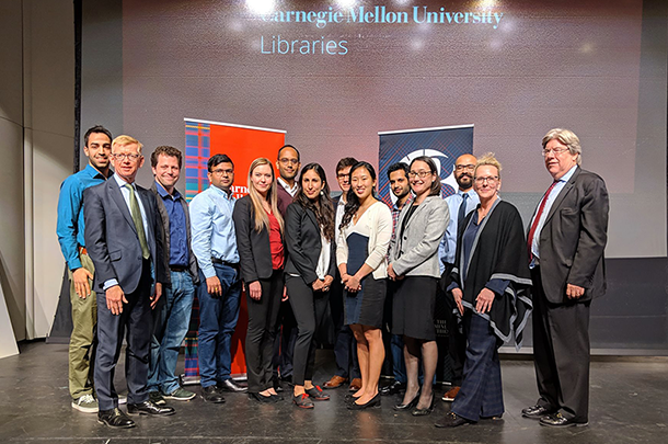 Group photo of 2019 Three Minute Thesis competition participants on stage