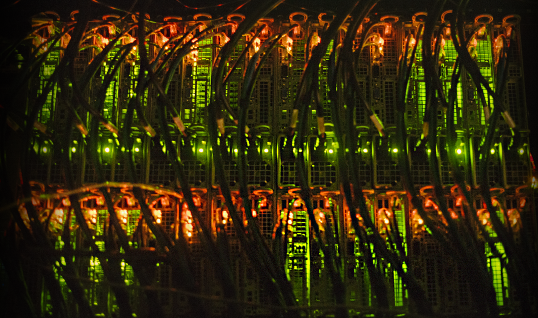 Wires plugged into the back of a computer