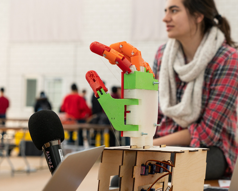 A plastic hand attached to a circuit board