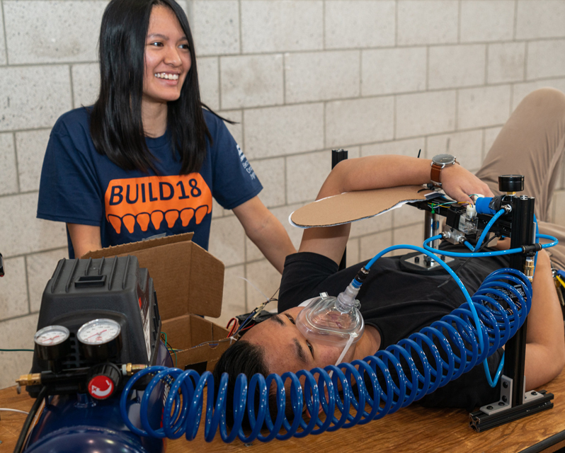 Student demos device with a mask