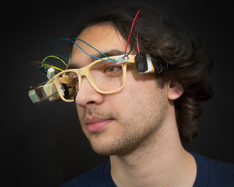 A student wearing altered glasses