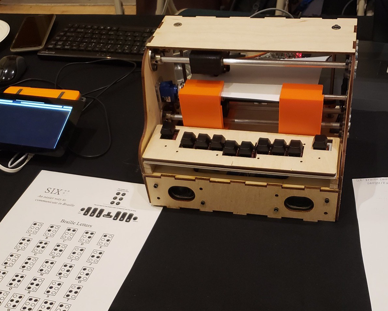 A machine with about twelve buttons next to a scantron