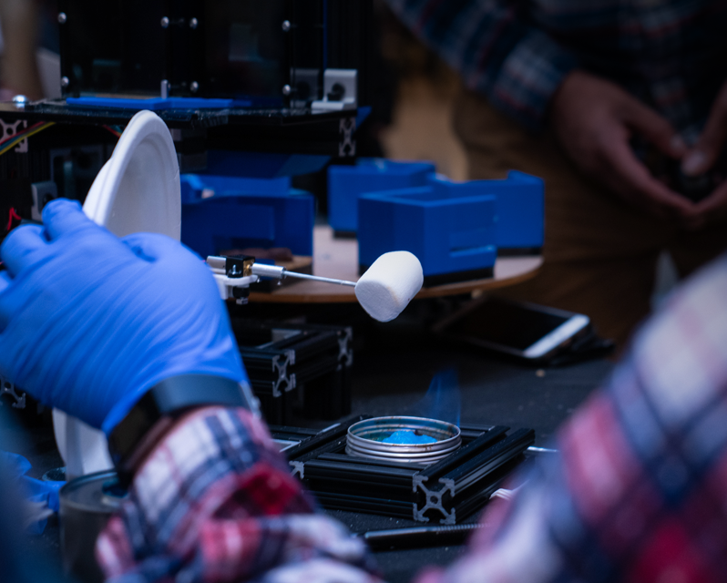 Student making smores in lab