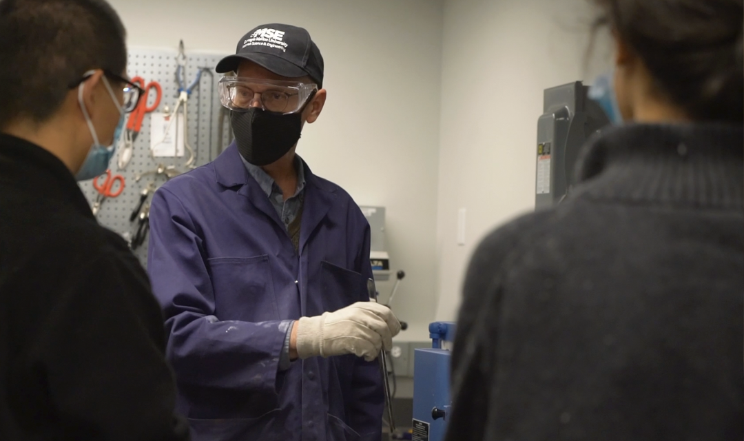 Chris Pistorius in the lab with two students