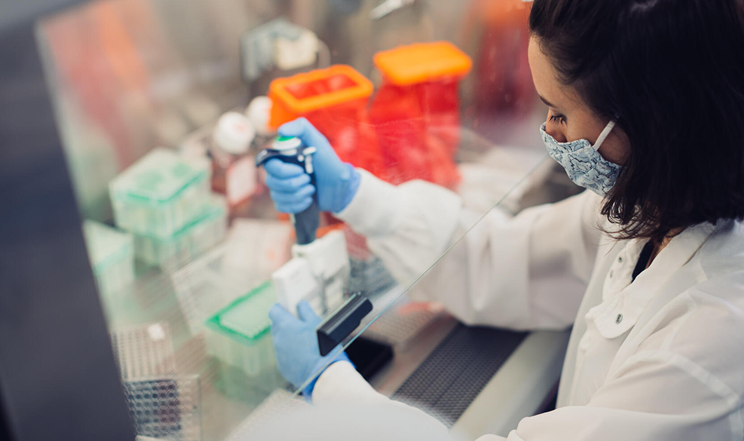 person working on lab equipment