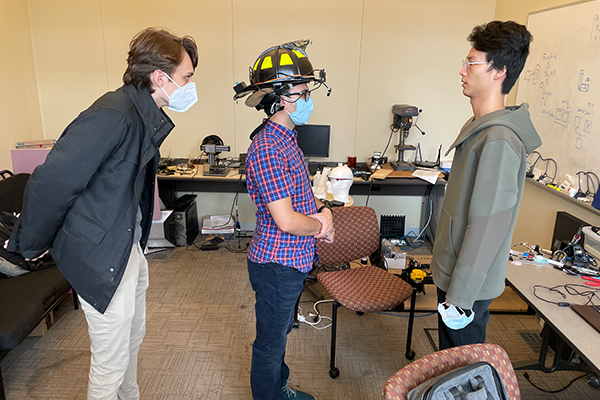 Students wearing haptic helmet