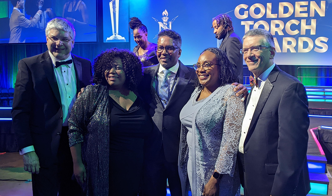 Group of people, including Dean Bill Sanders and Provost Jim Garrett, at the Torch awards