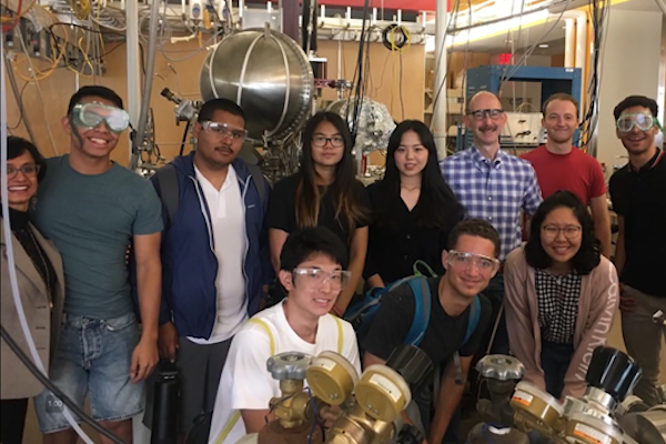 Students in lab with two professors