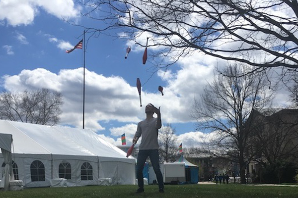 Student juggling outside on campus