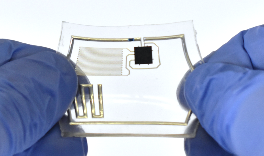 Gloved hands stretching a liquid circuit