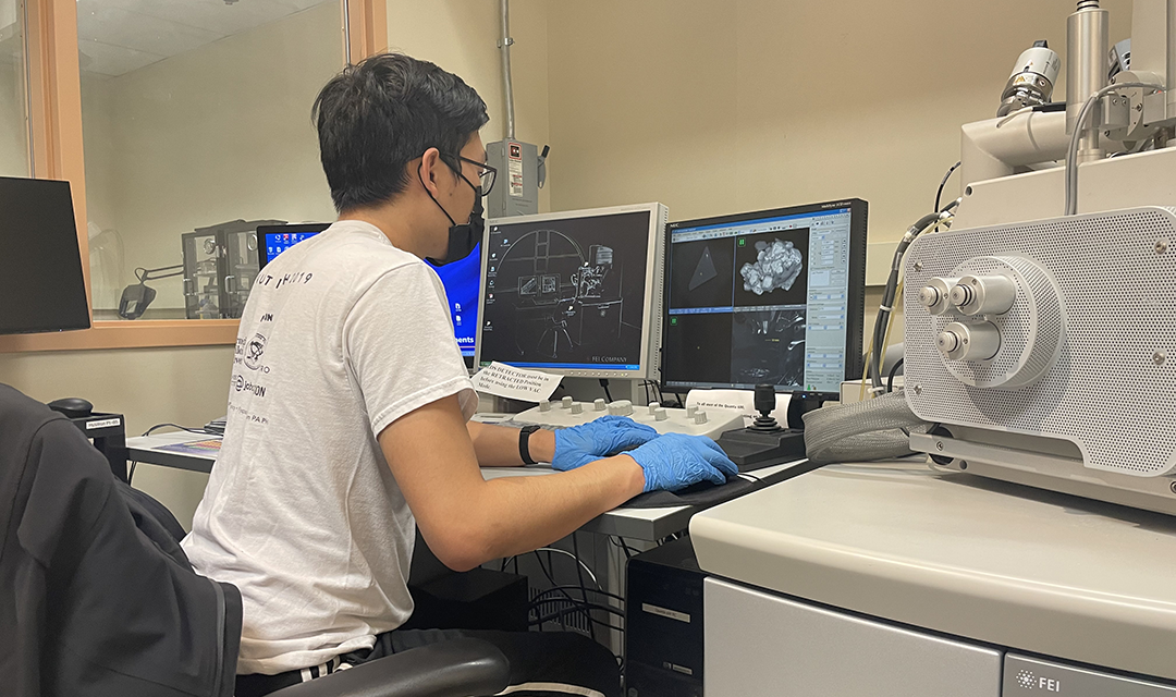 Terry Feng at a computer in a lab