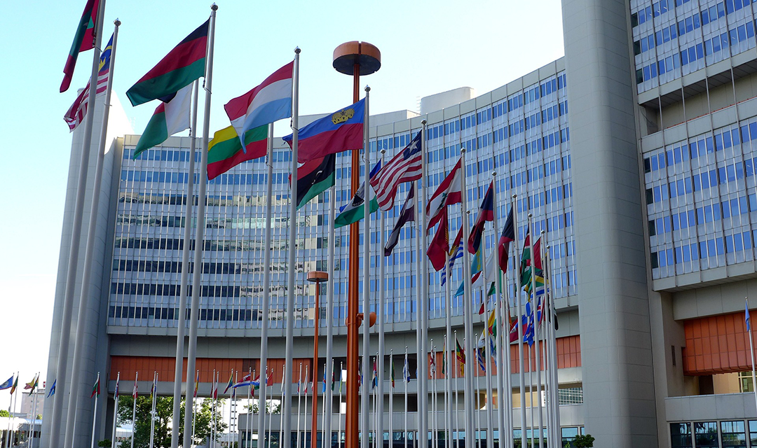 Flags from different countries flapping in the wind