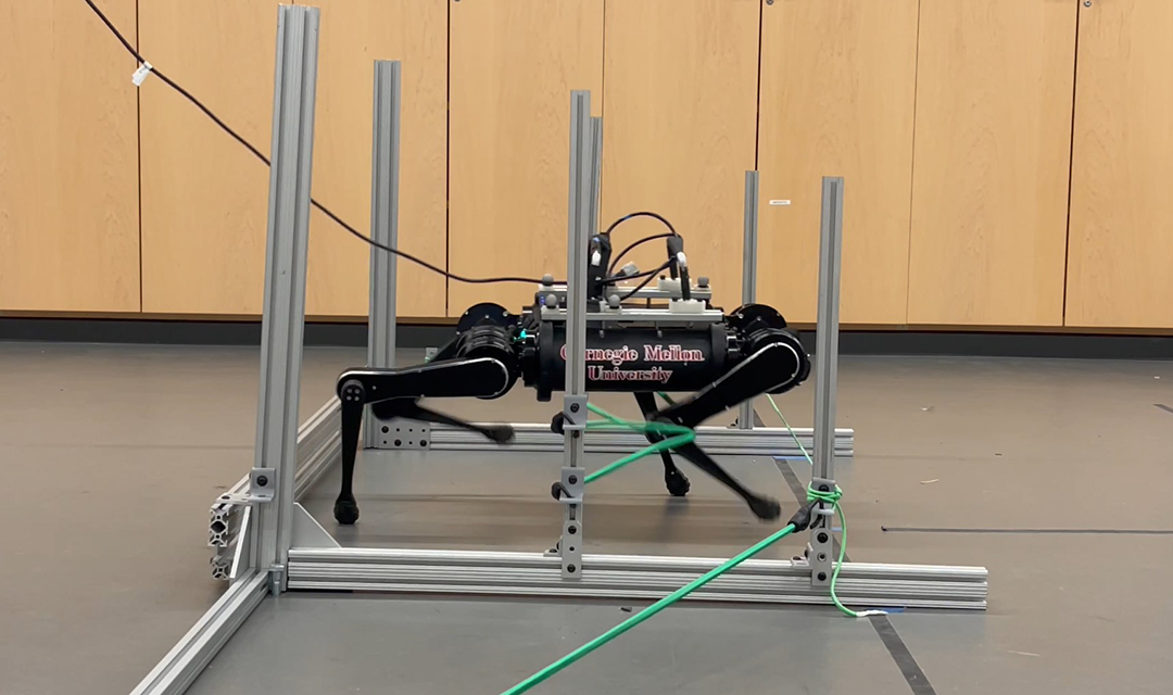 A four-legged robot stepping over bungee cords in an obstacle