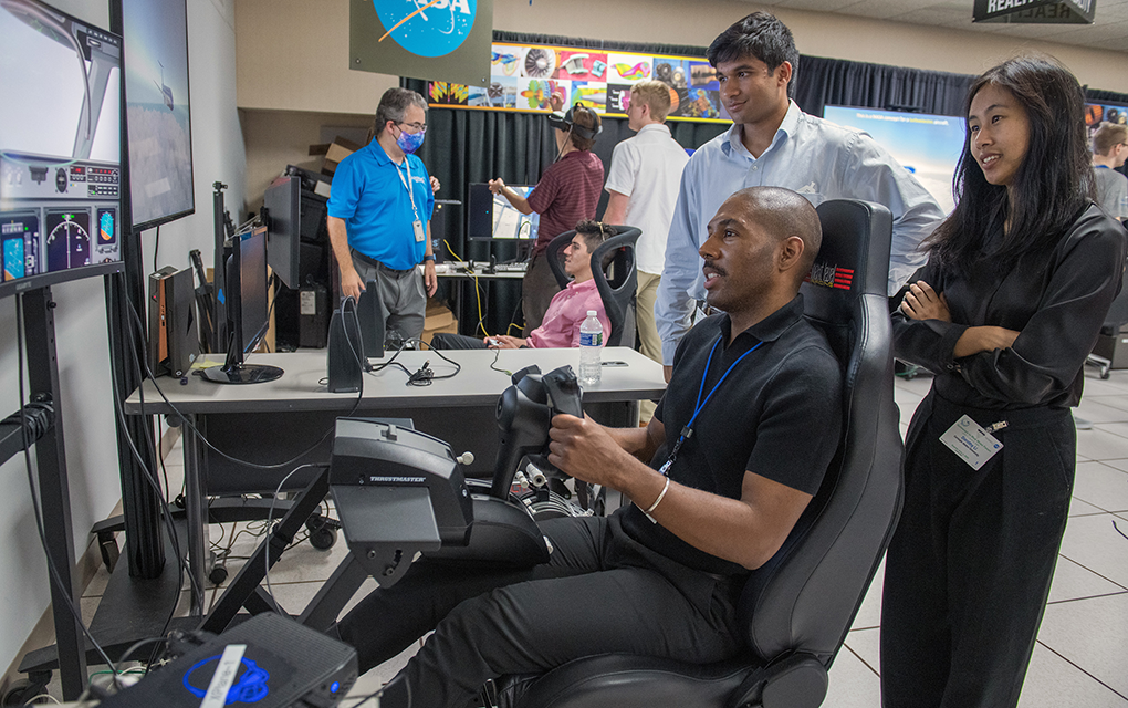 Man sitting in a chair and playing a video game