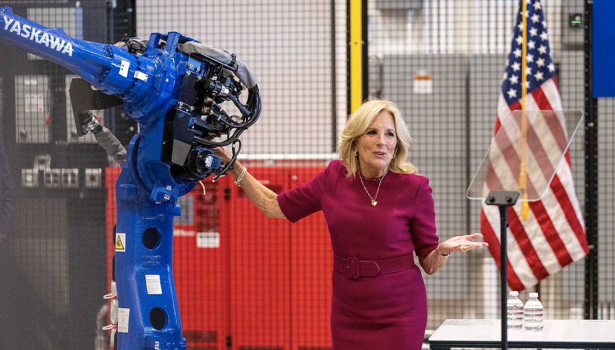 Jill Biden at Mill 19 with her hand on a robot