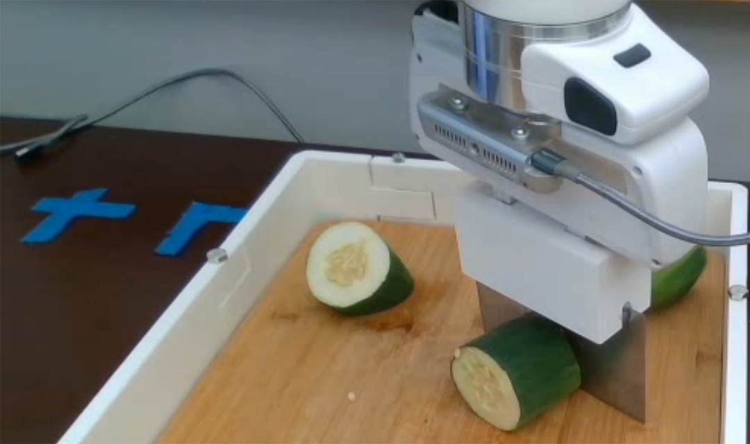 The robochop cutting a cucumber