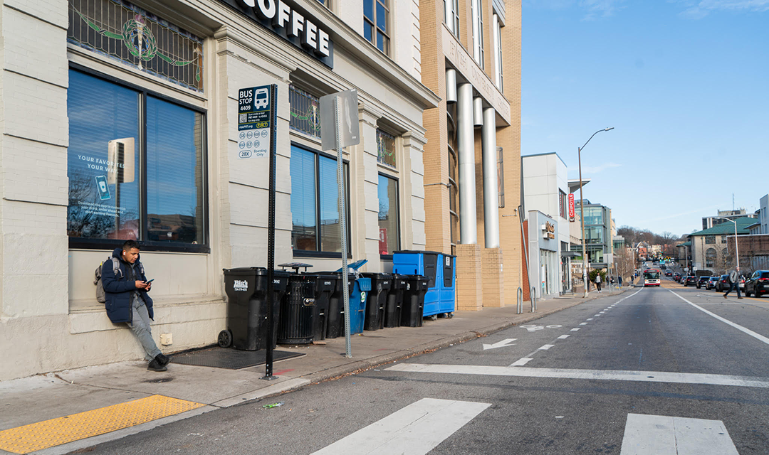 A student on the corner of S. Craig St. and Forbes Ave