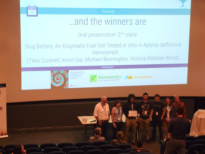 Group of student winners under their presentation