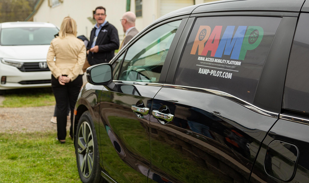 R.A.M.P. van with three people in background