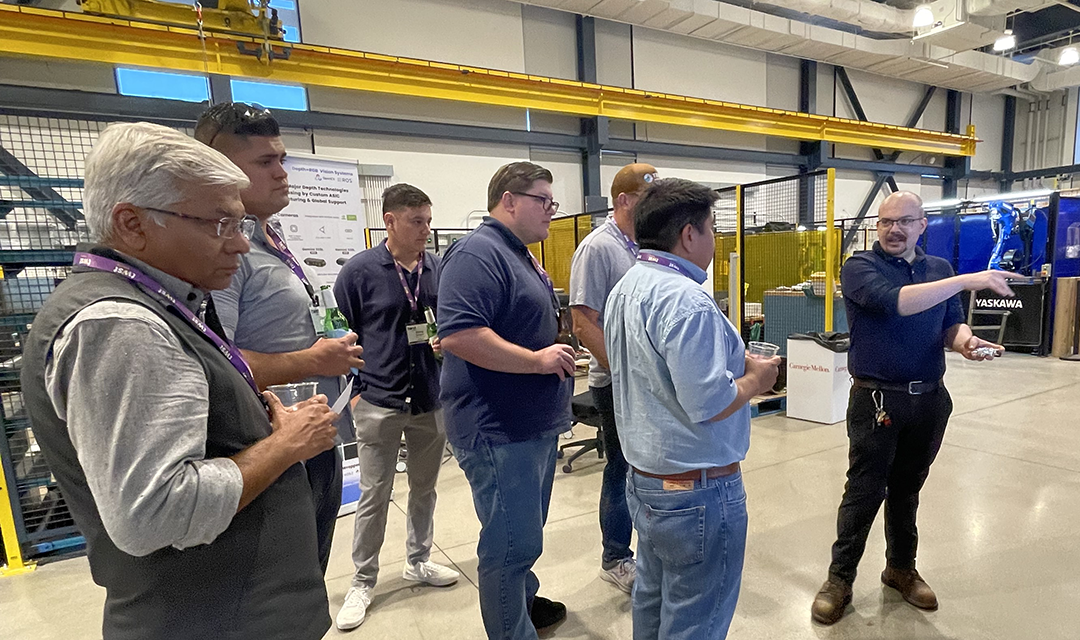 Group of people at Mill 19 for the AIMST Conference