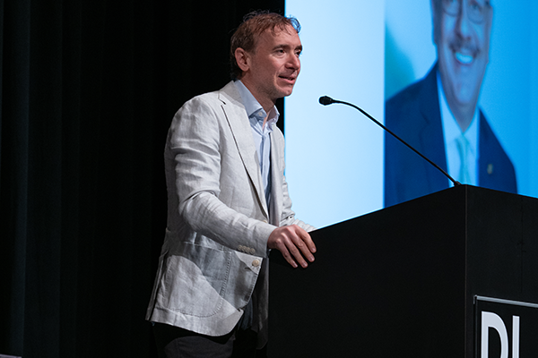 A man speaking at a podium