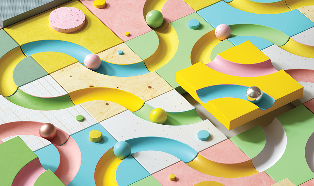 A colorful board with grooves cut for balls to move around inside
