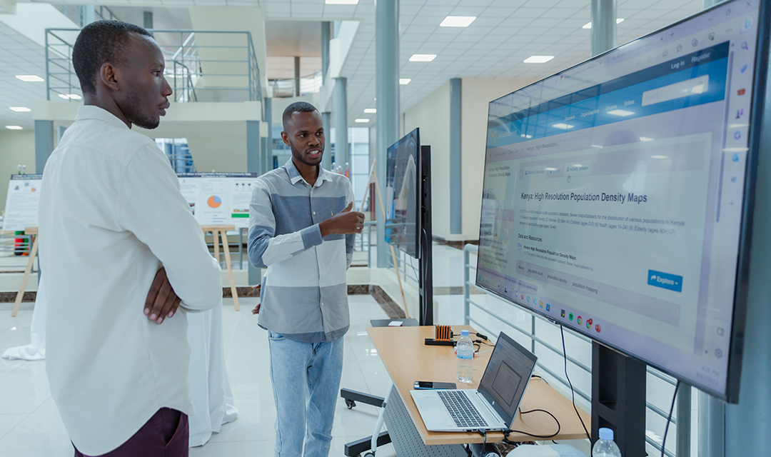 A man presenting his research to another man