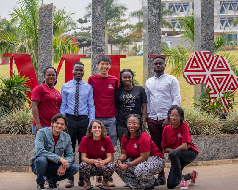 A group of students in front of the CMU-Africa sign